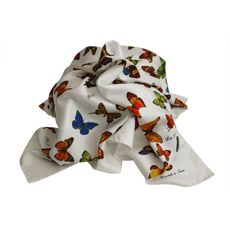 foulard in seta bianca con fantasia di farfalle colorate annodato