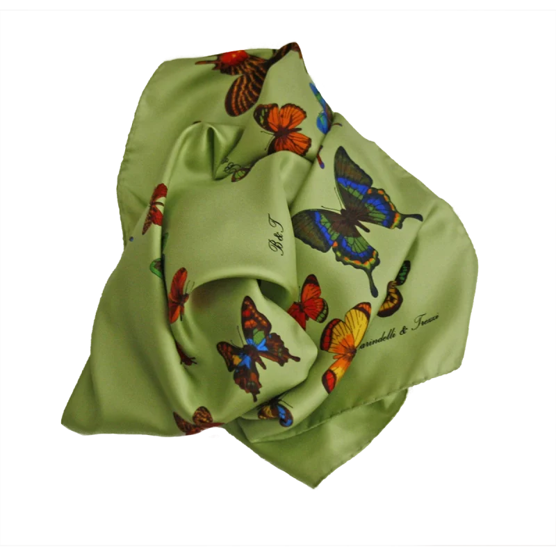 foulard in seta verde salvia con farfalle multicolore visto annodato